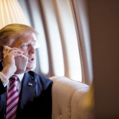 President Donald Trump talks on the phone aboard Air Force One during a flight to Philadelphia, Pennsylvania, to address a joint gathering of House and Senate Republicans, Thursday, January 26, 2017. This was the President’s first Trip aboard Air Force One. (Official White House Photo by Shealah Craighead)