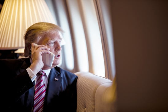 President Donald Trump talks on the phone aboard Air Force One during a flight to Philadelphia, Pennsylvania, to address a joint gathering of House and Senate Republicans, Thursday, January 26, 2017. This was the President’s first Trip aboard Air Force One. (Official White House Photo by Shealah Craighead)